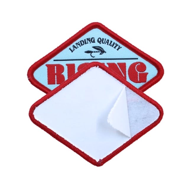 patch with backing and red text in the middle