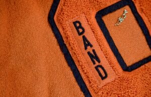 orange chenille patch sewn on jacket