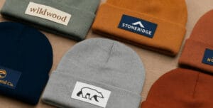 many beanies laid out on table